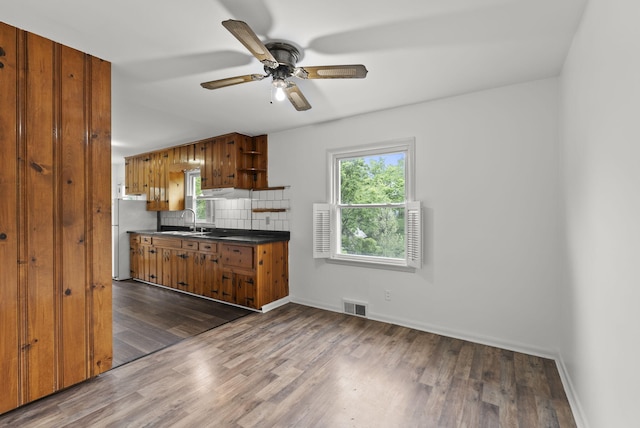 834 Boyd Ave, Danville, KY 40422 - kitchen with open shelves, freestanding refrigerator, dark countertops, wood finished floors, and tasteful backsplash