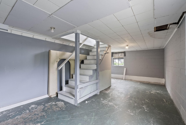 834 Boyd Ave, Danville, KY 40422 - below grade area with concrete block wall, stairs, and a paneled ceiling