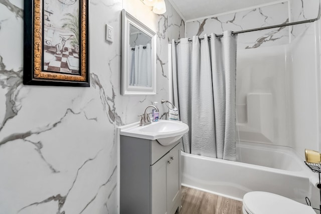 full bathroom with wood finished floors, vanity, toilet, and shower / tub combo with curtain