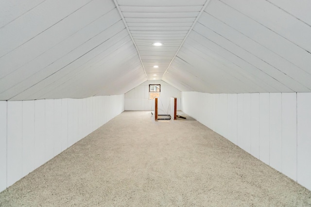 additional living space with lofted ceiling, carpet flooring, wooden walls, and recessed lighting