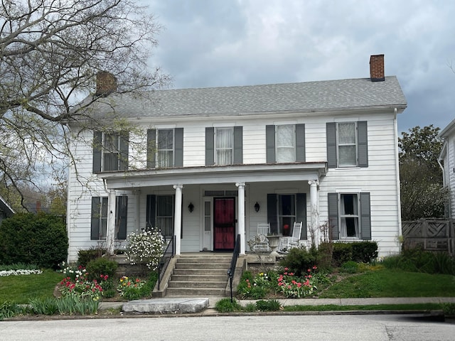 218 W Campbell St, Frankfort, KY 40601 - colonial house with a chimney and covered porch