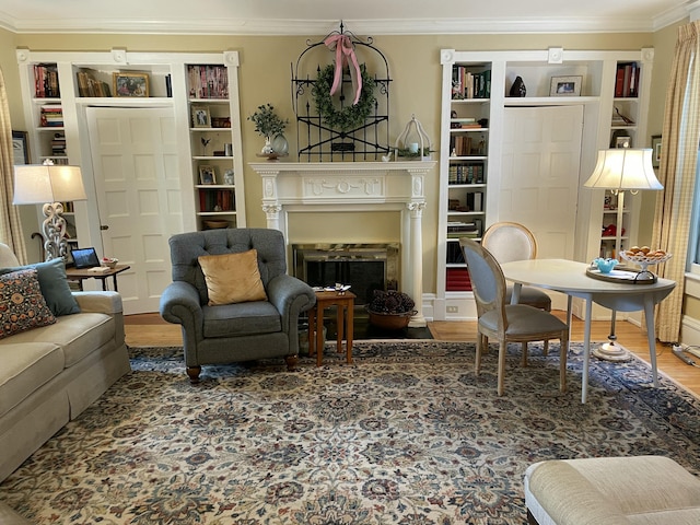 218 W Campbell St, Frankfort, KY 40601 - living room with crown molding, a fireplace, wood finished floors, and built in shelves