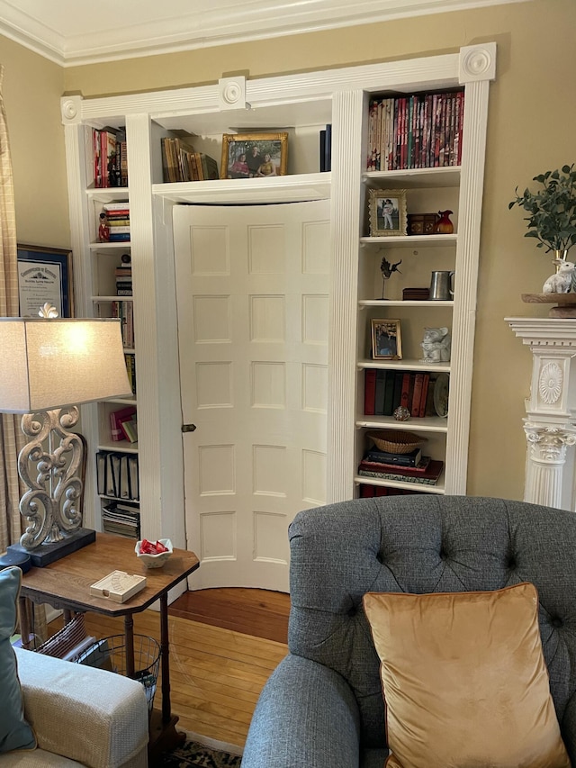 218 W Campbell St, Frankfort, KY 40601 - living area with wood finished floors, crown molding, and built in shelves
