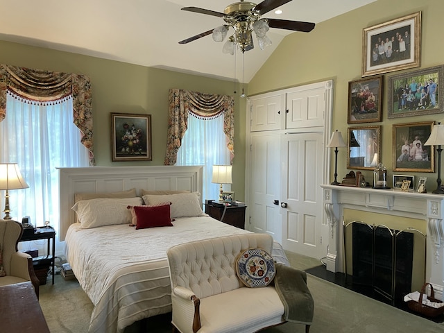 218 W Campbell St, Frankfort, KY 40601 - carpeted bedroom with vaulted ceiling, a fireplace, a closet, and ceiling fan