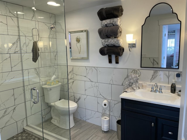 218 W Campbell St, Frankfort, KY 40601 - bathroom featuring tile walls, a shower stall, toilet, and vanity