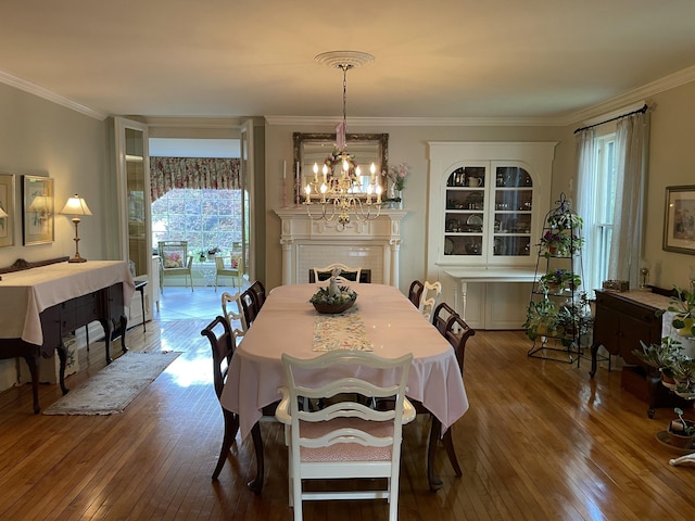 218 W Campbell St, Frankfort, KY 40601 - dining area featuring a chandelier, hardwood / wood-style floors, and ornamental molding