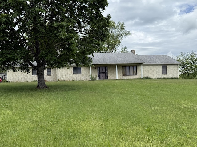 8023 Old Richmond Rd, Lexington, KY 40515 - view of front of house with a front lawn and a chimney