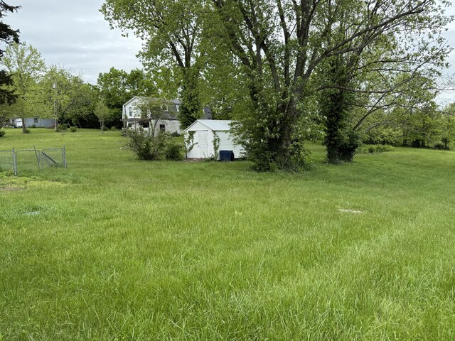 8023 Old Richmond Rd, Lexington, KY 40515 - view of yard with a storage unit and an outbuilding