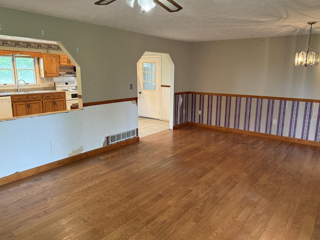 8023 Old Richmond Rd, Lexington, KY 40515 - spare room with a sink, a ceiling fan, baseboards, light wood finished floors, and a textured ceiling