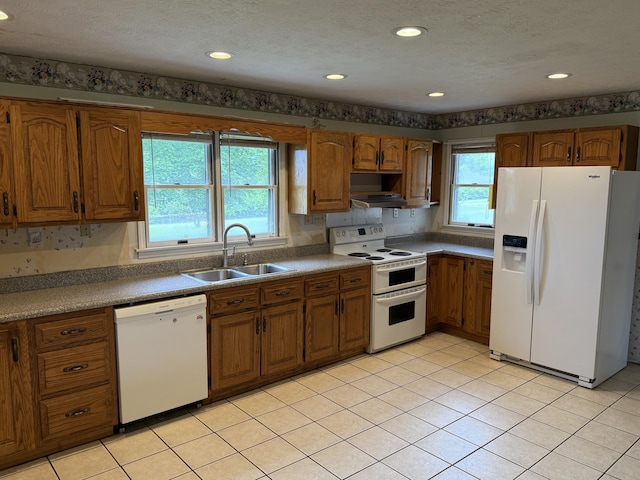 8023 Old Richmond Rd, Lexington, KY 40515 - kitchen featuring white appliances, a sink, brown cabinets, a textured ceiling, and ventilation hood