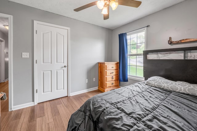 501 Ashley Ct, Berea, KY 40403 - bedroom featuring wood finished floors, baseboards, and ceiling fan