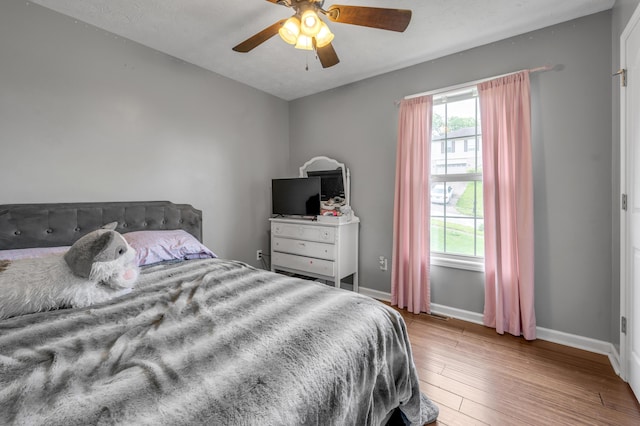 501 Ashley Ct, Berea, KY 40403 - bedroom with baseboards, wood finished floors, and a ceiling fan