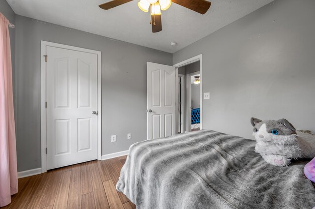 501 Ashley Ct, Berea, KY 40403 - bedroom featuring wood finished floors, baseboards, and a ceiling fan