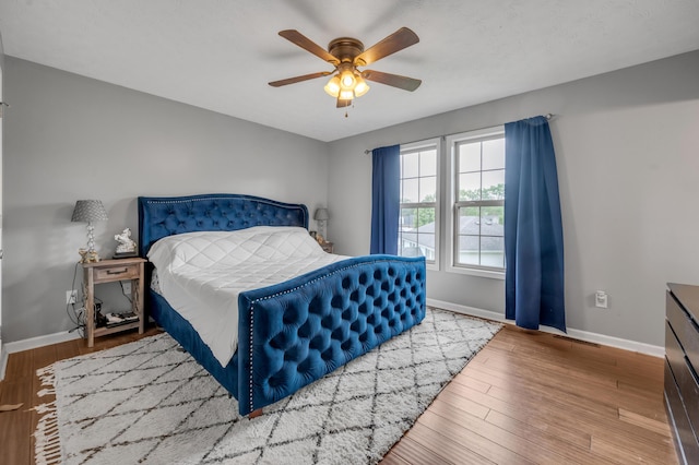 501 Ashley Ct, Berea, KY 40403 - bedroom with baseboards, wood finished floors, and ceiling fan
