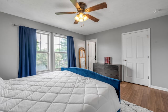 501 Ashley Ct, Berea, KY 40403 - bedroom featuring wood finished floors, baseboards, and ceiling fan