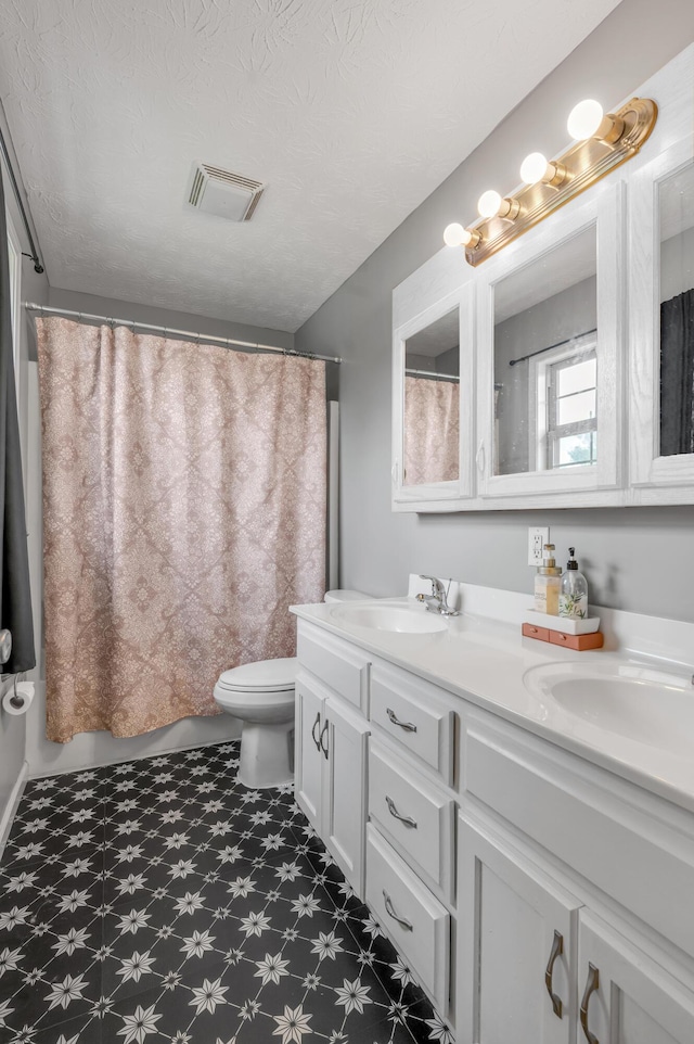 501 Ashley Ct, Berea, KY 40403 - bathroom with tile patterned floors, toilet, double vanity, curtained shower, and a textured ceiling