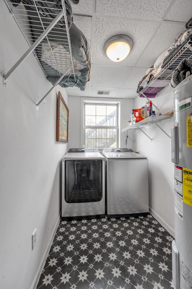 501 Ashley Ct, Berea, KY 40403 - washroom with tile patterned floors, electric water heater, washing machine and clothes dryer, and baseboards
