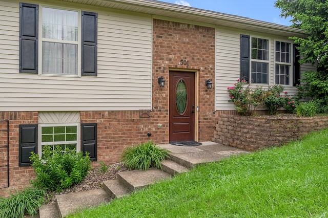 501 Ashley Ct, Berea, KY 40403 - view of exterior entry with brick siding and a lawn