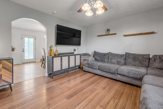 501 Ashley Ct, Berea, KY 40403 - living area with arched walkways, ceiling fan, and wood finished floors