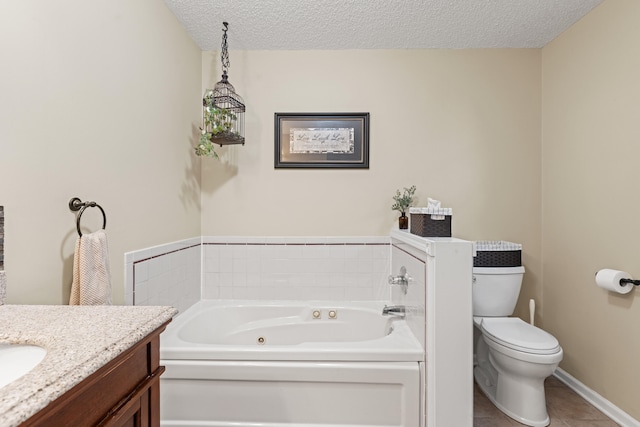 bathroom with toilet, a whirlpool tub, tile patterned flooring, a textured ceiling, and vanity