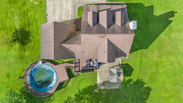 view of subject property with a pool