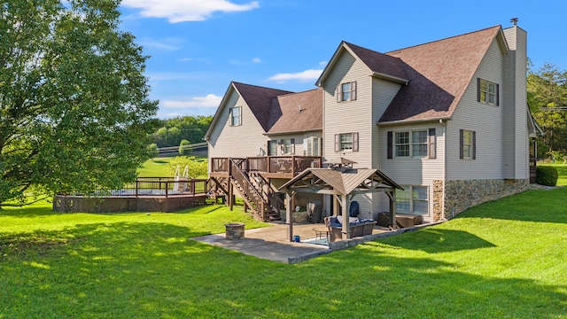 back of house featuring a wooden deck, stairs, a patio, and a lawn