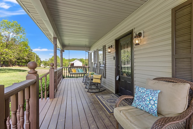 wooden deck featuring a porch