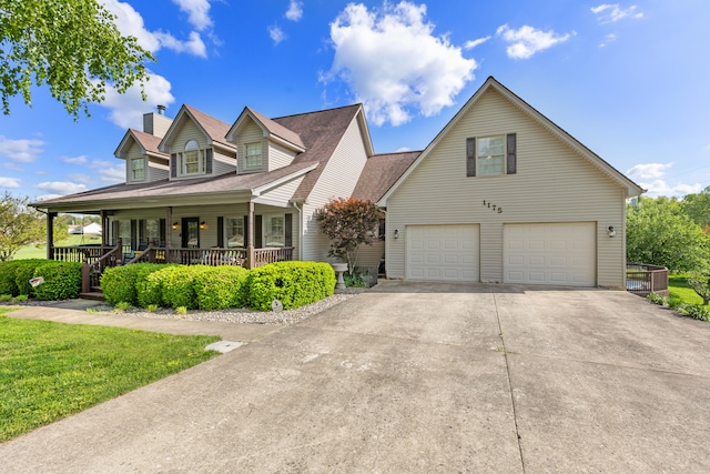 cape cod home with an attached garage, concrete driveway, covered porch, and a chimney