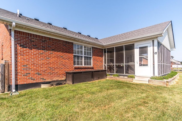 129 General Cleburne Dr, Richmond, KY 40475 - rear view of property featuring a sunroom, brick siding, and a lawn