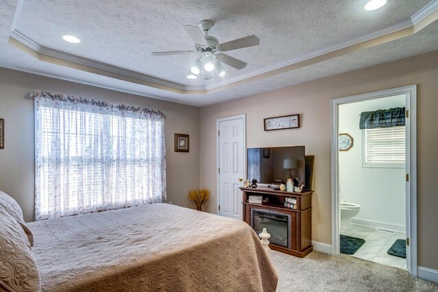 129 General Cleburne Dr, Richmond, KY 40475 - bedroom with a tray ceiling, ornamental molding, multiple windows, light colored carpet, and ensuite bath