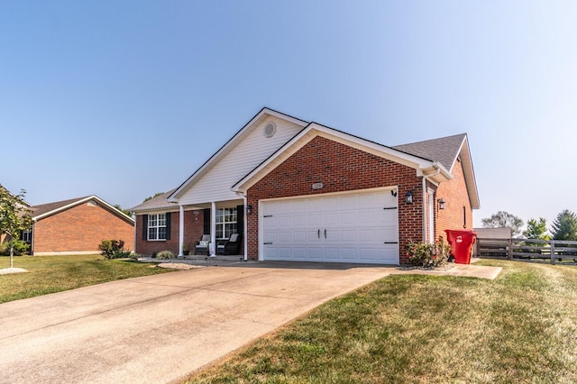 129 General Cleburne Dr, Richmond, KY 40475 - view of front of home with brick siding, an attached garage, concrete driveway, and a porch