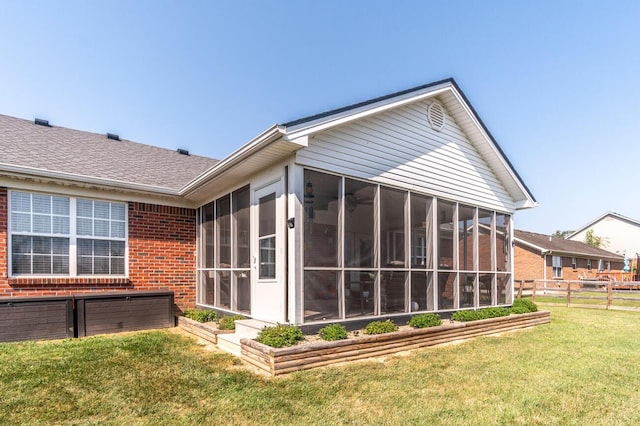 129 General Cleburne Dr, Richmond, KY 40475 - back of house featuring brick siding, a sunroom, and roof with shingles