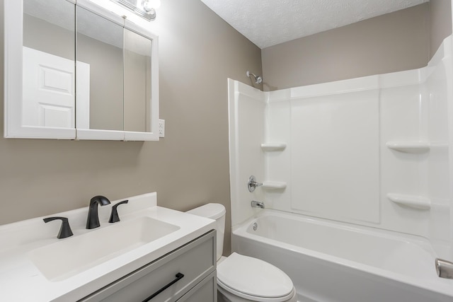 full bathroom with a textured ceiling, toilet, bathtub / shower combination, and vanity