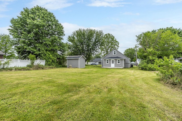view of yard featuring an outbuilding and a shed
