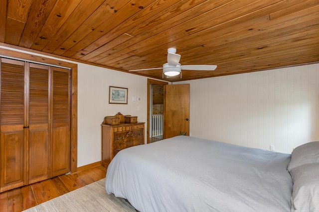134 Pandora Dr, Harrodsburg, KY 40330 - bedroom with wood ceiling, light wood-type flooring, a closet, ceiling fan, and wooden walls