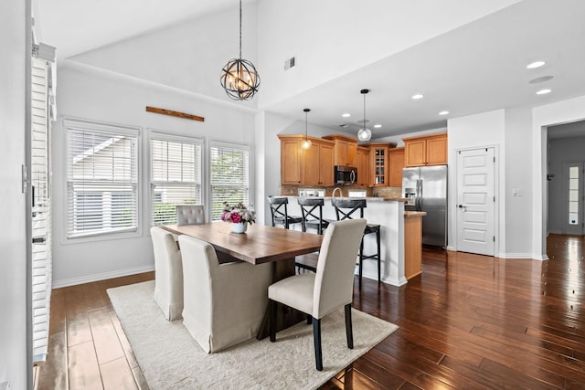 dining room with recessed lighting, dark wood finished floors, a chandelier, and baseboards