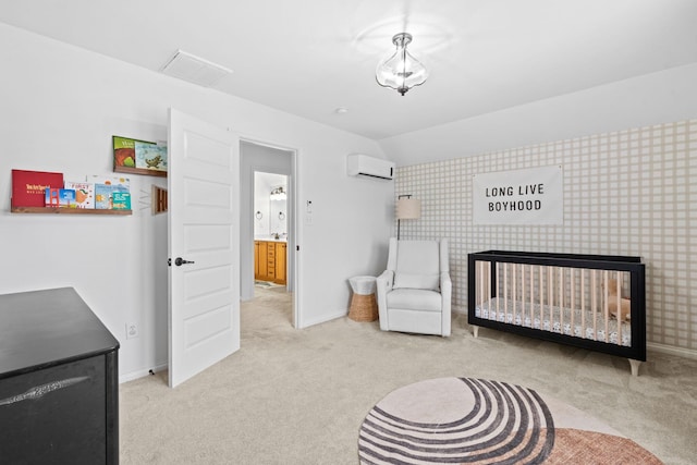 bedroom with carpet, a wall mounted AC, a crib, and baseboards