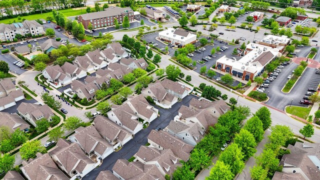aerial view of property's location with nearby suburban area
