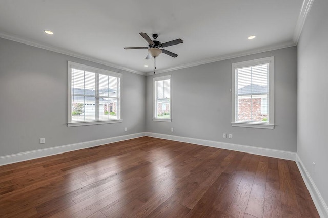 spare room featuring dark wood-style floors, a ceiling fan, baseboards, recessed lighting, and crown molding