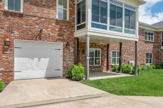 view of front of property with driveway, an attached garage, brick siding, and a front yard
