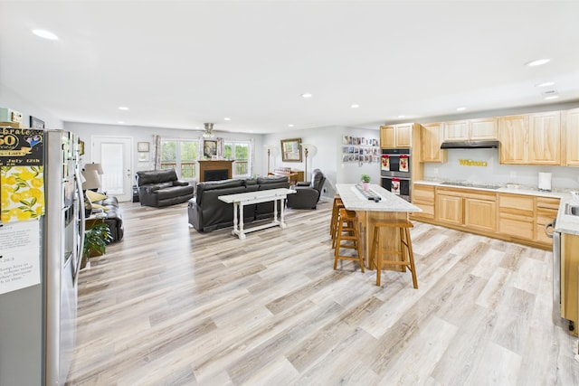663 John R Jones Rd, London, KY 40741 - kitchen featuring light brown cabinets, under cabinet range hood, light countertops, stainless steel appliances, and recessed lighting