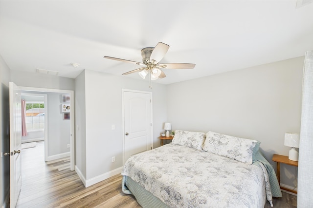 663 John R Jones Rd, London, KY 40741 - bedroom with light wood-style flooring, baseboards, a ceiling fan, and a closet