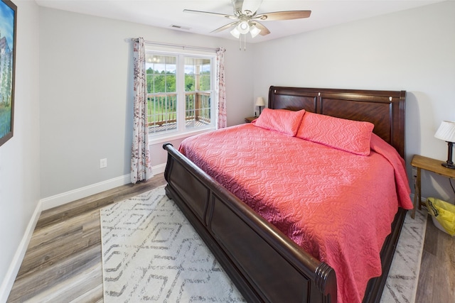663 John R Jones Rd, London, KY 40741 - bedroom featuring baseboards, wood finished floors, and ceiling fan