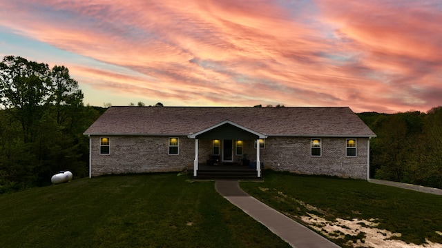 663 John R Jones Rd, London, KY 40741 - view of front of house featuring a front lawn, brick siding, and a porch