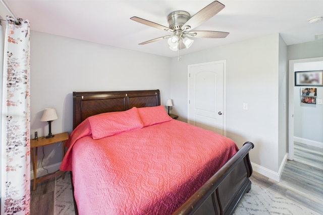 663 John R Jones Rd, London, KY 40741 - bedroom with light wood-type flooring, baseboards, and a ceiling fan