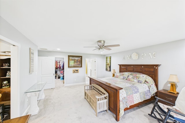 663 John R Jones Rd, London, KY 40741 - bedroom featuring a spacious closet, light colored carpet, a closet, baseboards, and a ceiling fan