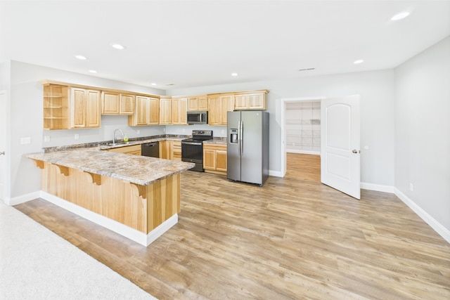 663 John R Jones Rd, London, KY 40741 - kitchen featuring stainless steel appliances, light brown cabinetry, a peninsula, recessed lighting, and baseboards