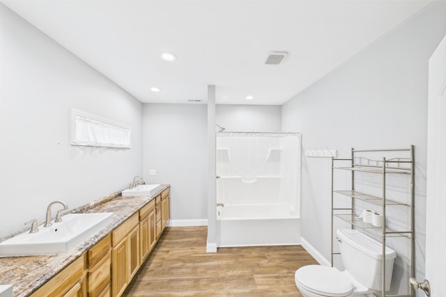 663 John R Jones Rd, London, KY 40741 - bathroom featuring toilet, wood finished floors, shower / bath combination with curtain, double vanity, and recessed lighting