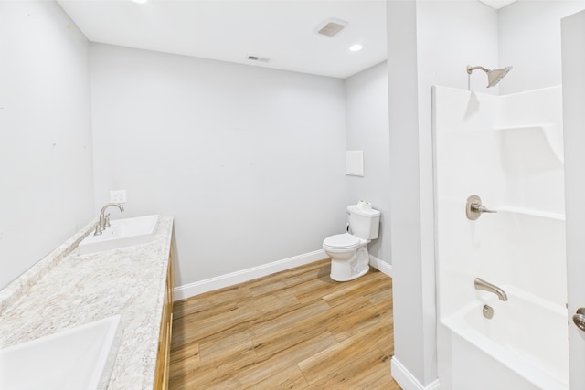 663 John R Jones Rd, London, KY 40741 - full bath featuring toilet, wood finished floors, shower / tub combination, baseboards, and double vanity