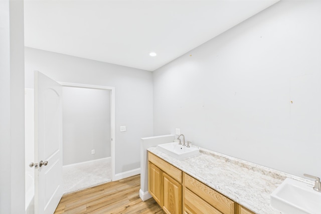 663 John R Jones Rd, London, KY 40741 - bathroom with wood finished floors, baseboards, and double vanity